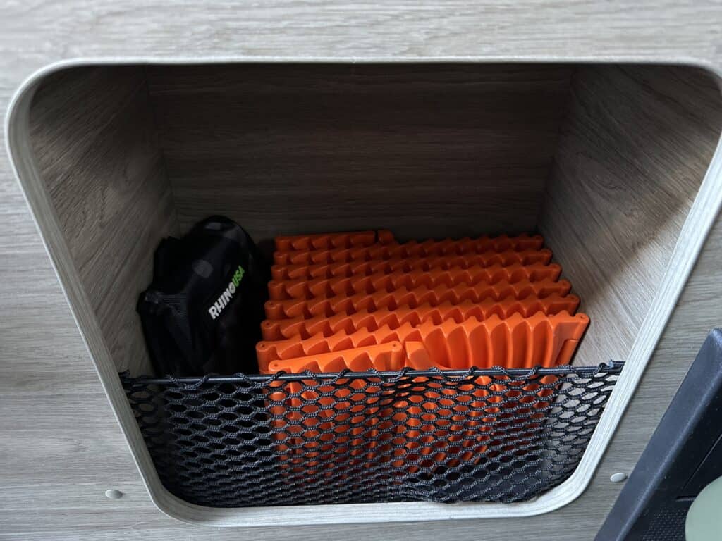 GoTreads and Rhino shovel folded up inside a van cubby