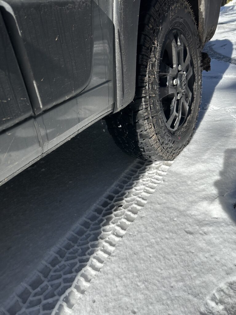 falken wildpeak at4w tire in snow showing tracks