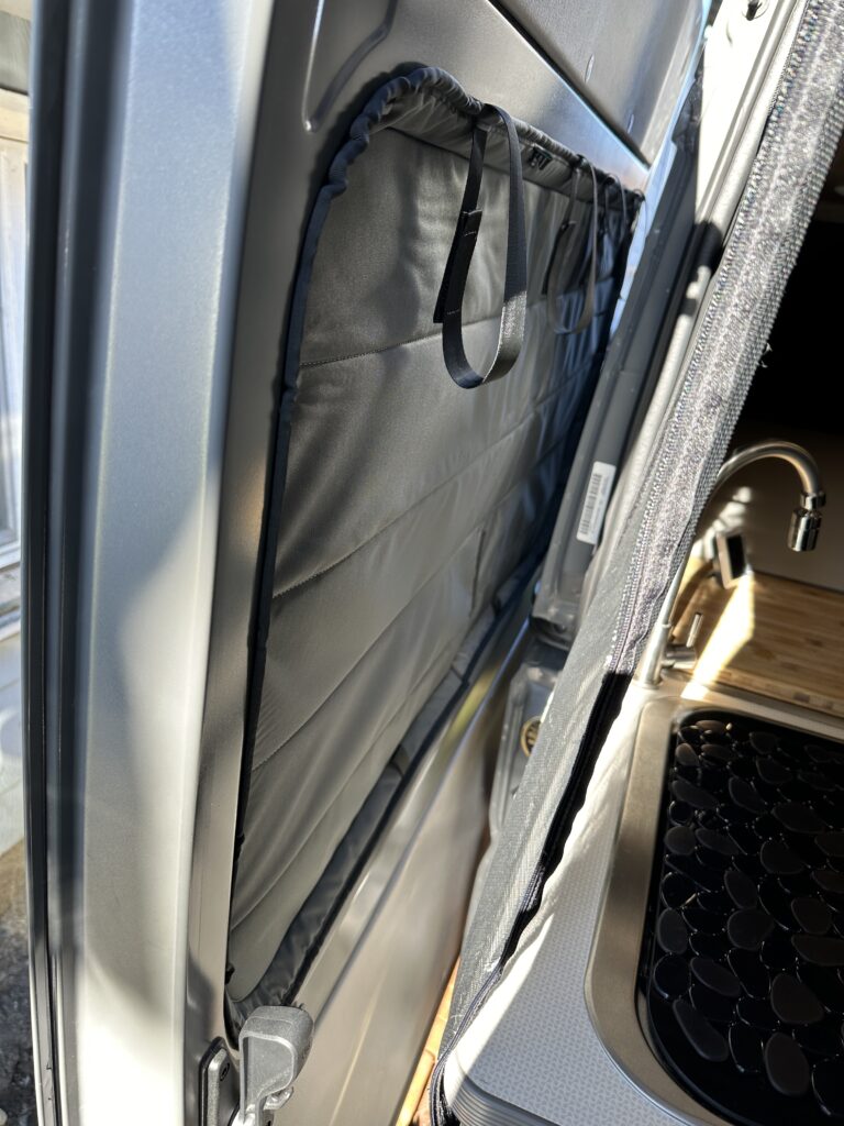 slider side door with van essentials insulated window cover in place