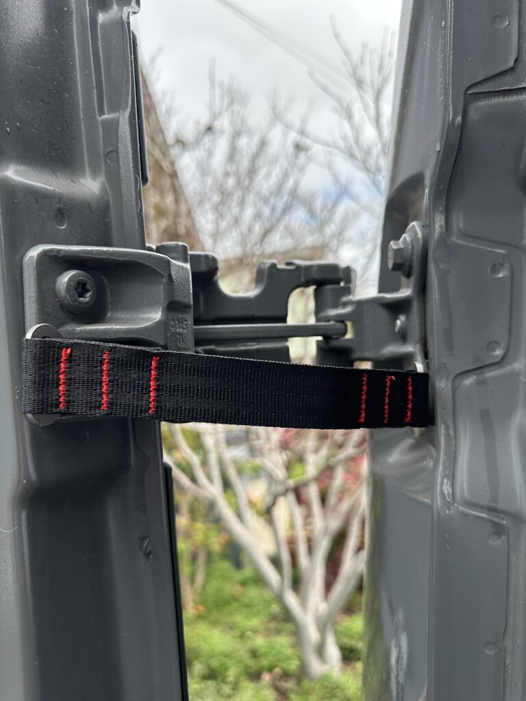 door strap on hinge door slightly open and strap taut