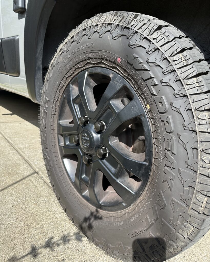 front view of promaster wheel with black lug nut covers on
