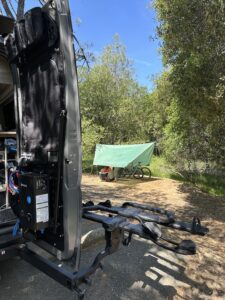 our rear van door in the foreground and a canopy in the distance